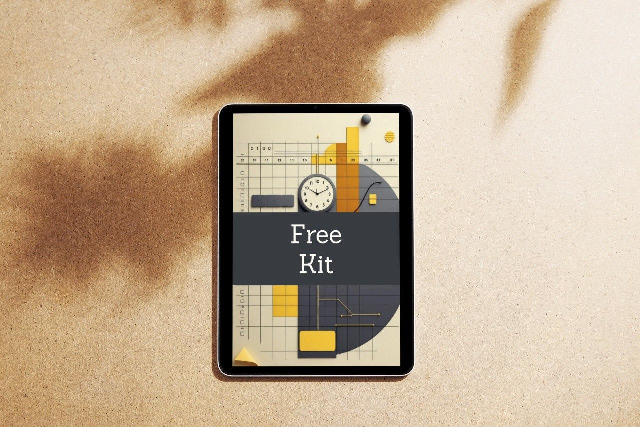 A tablet device lying on a textured beige surface with soft brown shadows. The screen displays a graphic cover titled 'Trail Unit' with abstract geometric shapes in yellow, orange, gray, and cream.
